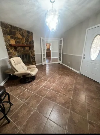 a view of a livingroom with furniture and window