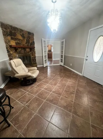 a view of a livingroom with furniture and window
