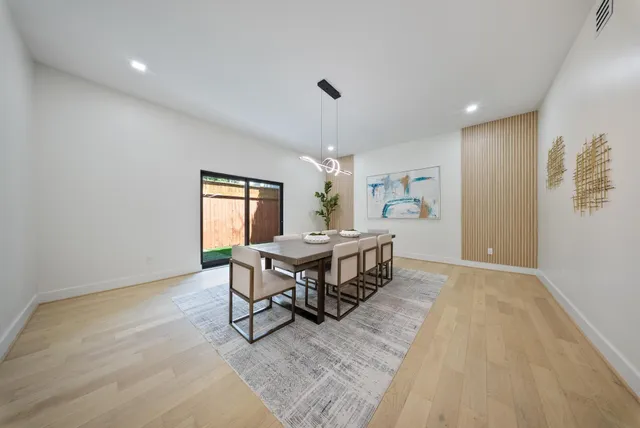 a bathroom with a sink double vanity granite tub shower and a mirror