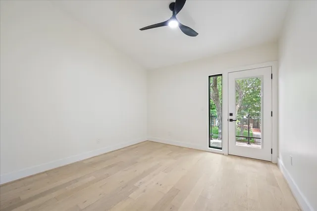 a view of walk in closet with empty racks