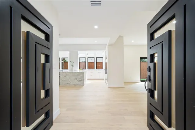 a kitchen with stainless steel appliances granite countertop a stove and a sink