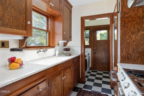 a kitchen with stainless steel appliances a sink and a window