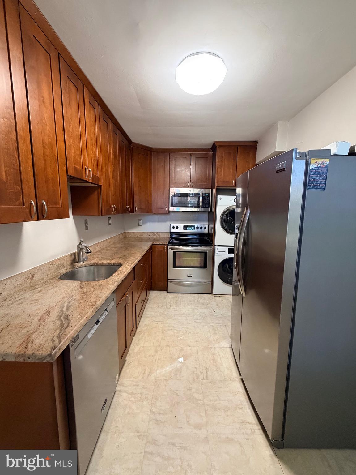 2600 16th Street South, Unit 714 Arlington, VA 22204 - Photo 2 of 10 a kitchen with stainless steel appliances granite countertop a refrigerator a stove a sink and dishwasher
