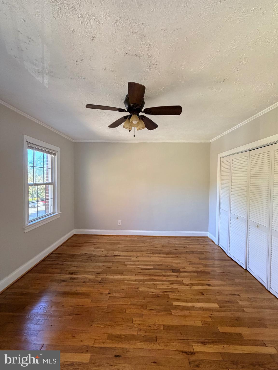 2600 16th Street South, Unit 714 Arlington, VA 22204 - Photo 7 of 10 a view of empty room with wooden floor and window