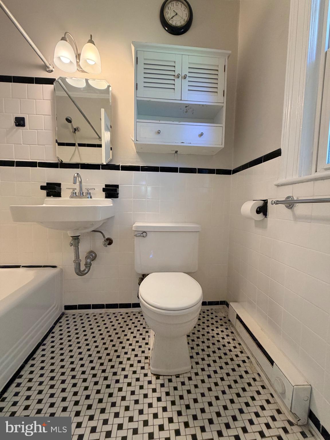 2600 16th Street South, Unit 714 Arlington, VA 22204 - Photo 8 of 10 a bathroom with a sink a toilet and mirror