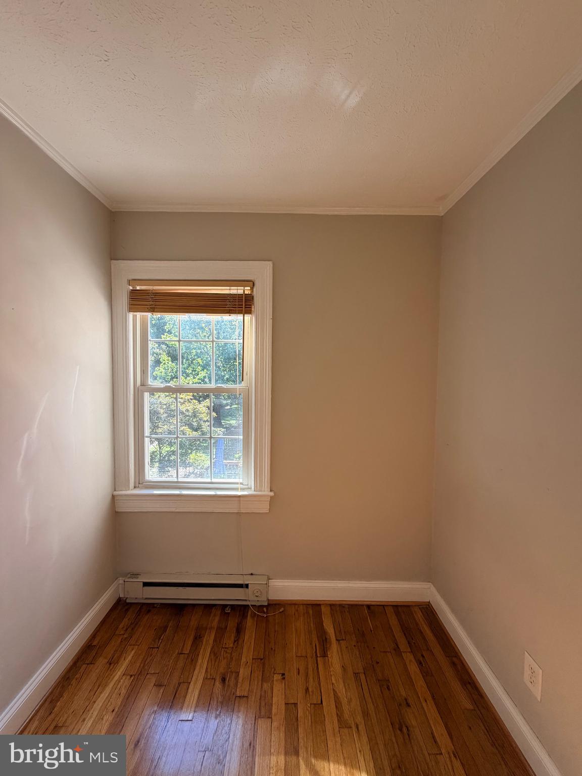 2600 16th Street South, Unit 714 Arlington, VA 22204 - Photo 10 of 10 an empty room with wooden floor and windows