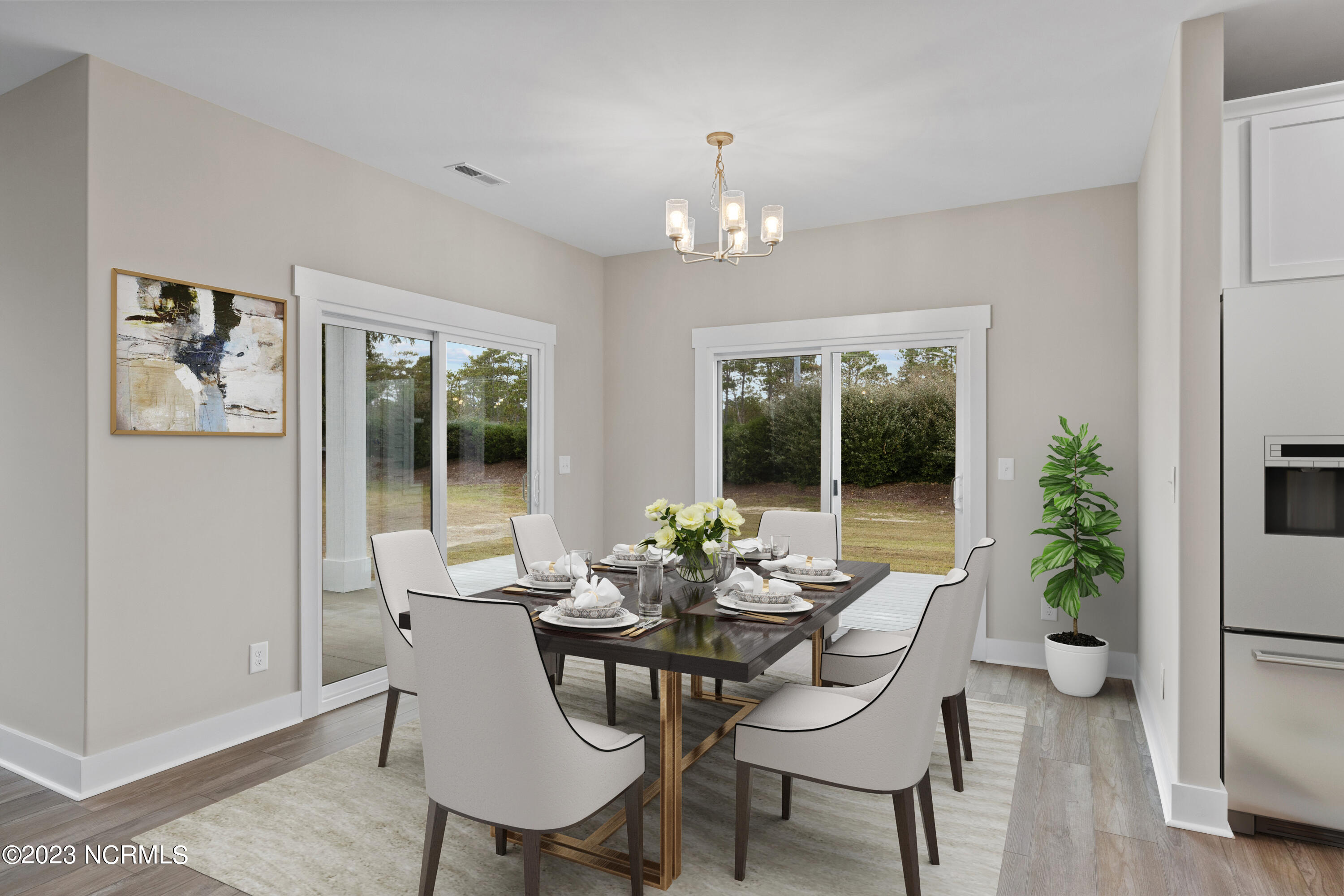 307 Coastline Circle Cedar Point, NC 28584 - Photo 15 of 66 Virtually Staged Dining Area open to kitchen and living room Lexi II