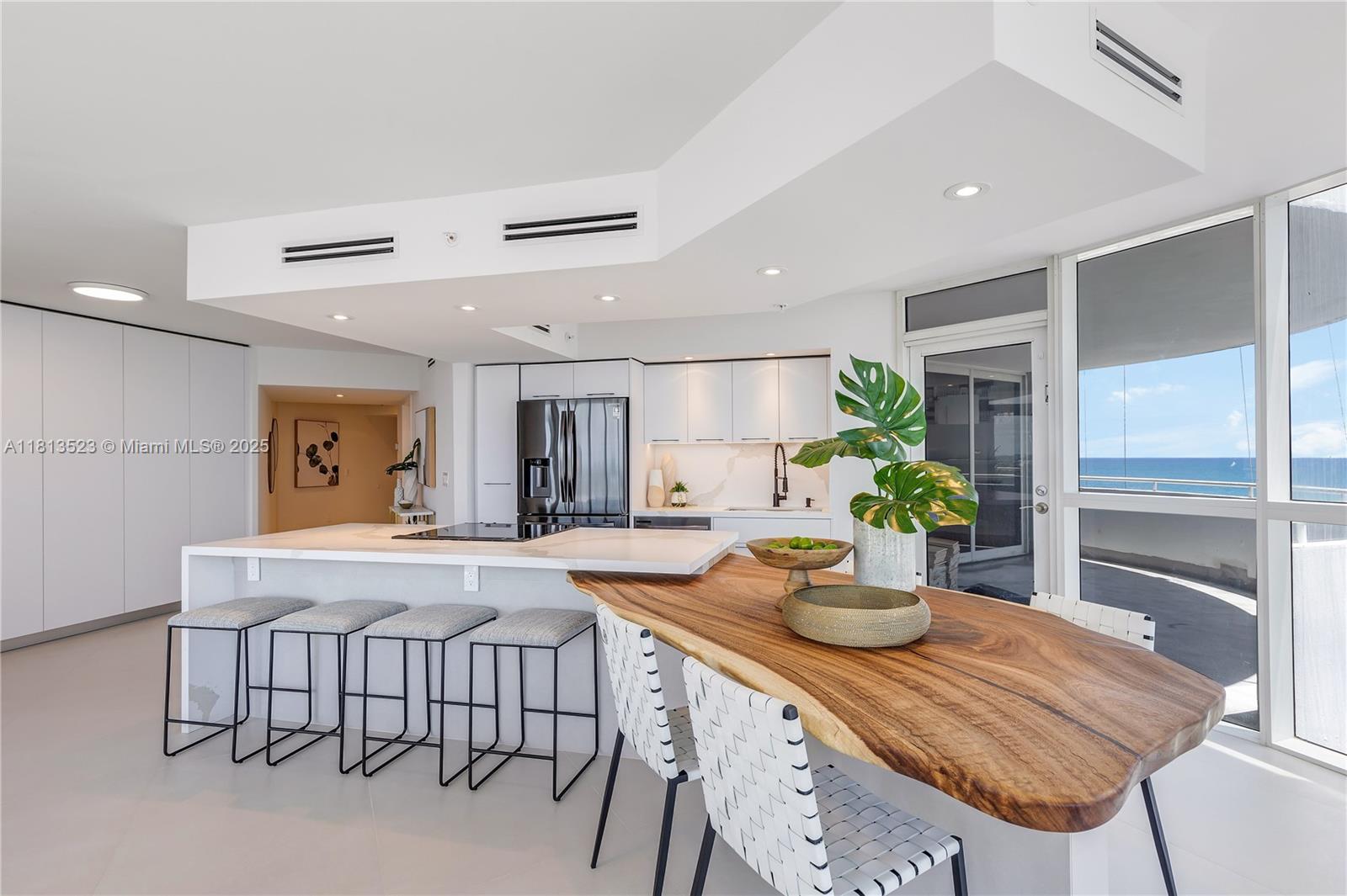 6301 Collins Avenue, Unit 1405 Miami Beach, FL 33141 - Photo 11 of 34 a dining room with furniture and window