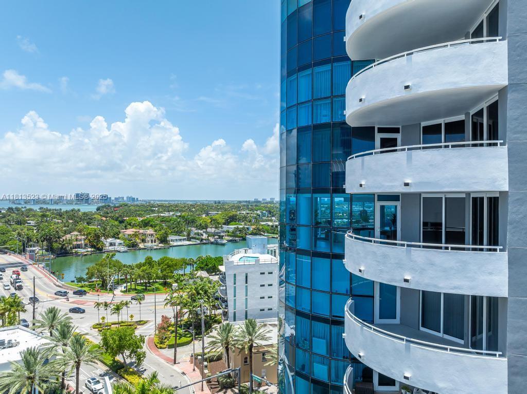 6301 Collins Avenue, Unit 1405 Miami Beach, FL 33141 - Photo 22 of 34 a balcony with table and chairs