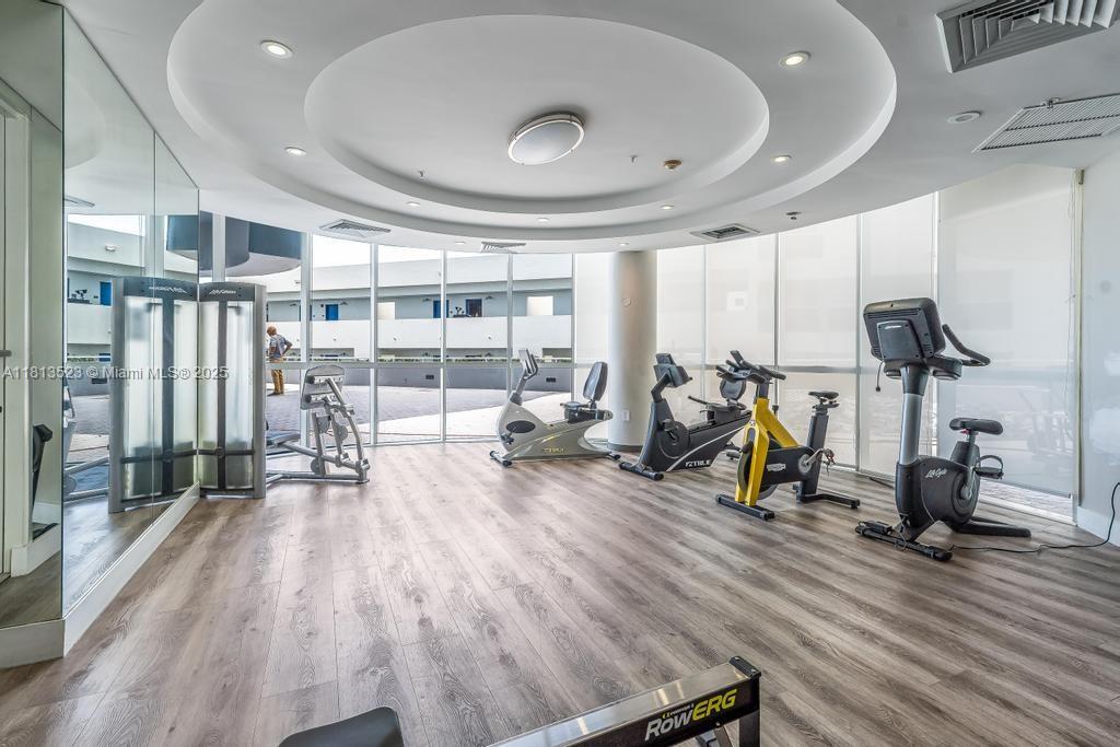 6301 Collins Avenue, Unit 1405 Miami Beach, FL 33141 - Photo 28 of 34 a view of a room with gym equipment