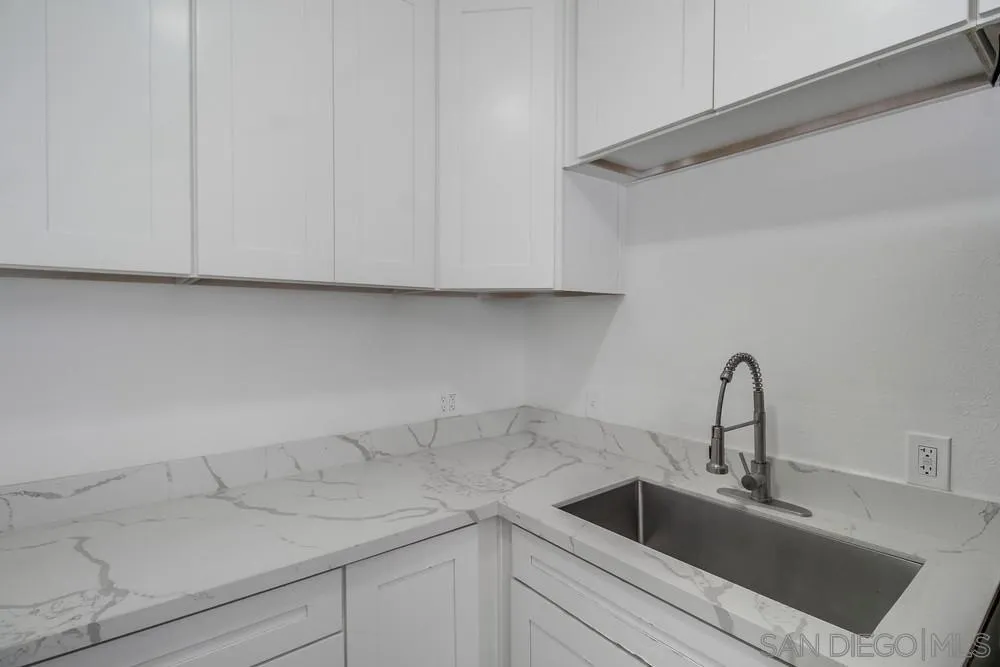 734-738 Grand Avenue Spring Valley, CA 91977 - Photo 13 of 30 a kitchen with a sink and cabinets