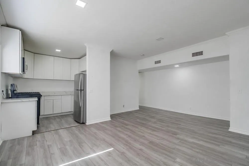 734-738 Grand Avenue Spring Valley, CA 91977 - Photo 14 of 30 a view of a kitchen with a sink and a refrigerator