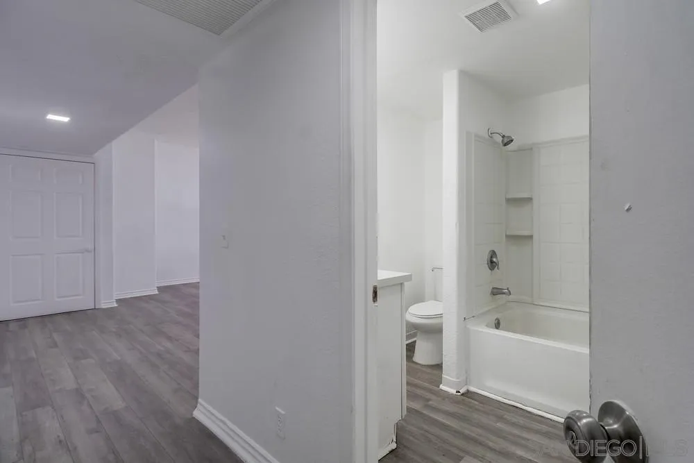 734-738 Grand Avenue Spring Valley, CA 91977 - Photo 26 of 30 a bathroom with a bathtub and a toilet