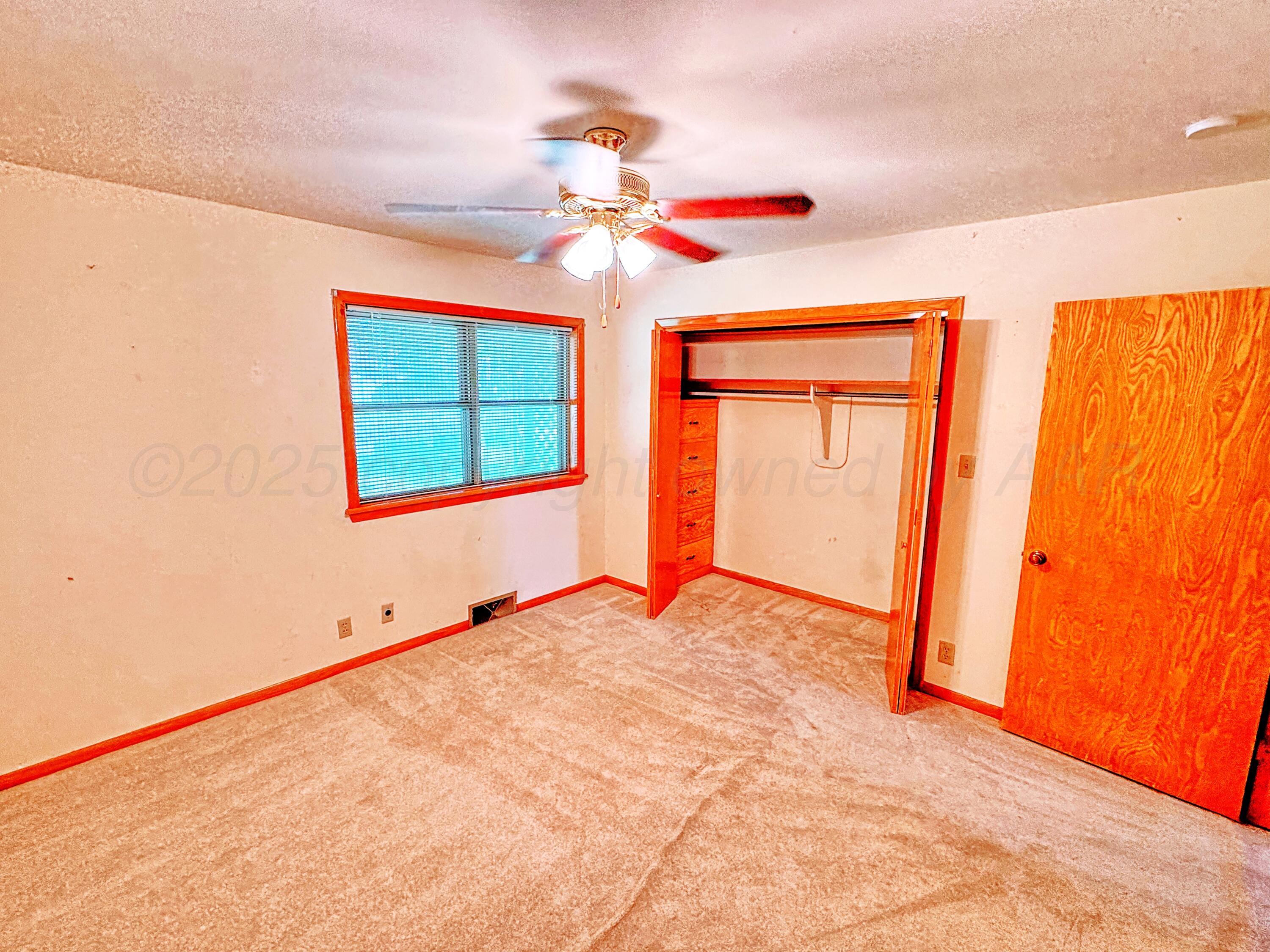 1301 South Fordham Street Perryton, TX 79070 - Photo 12 of 25 1301 Fordham primary bedroom