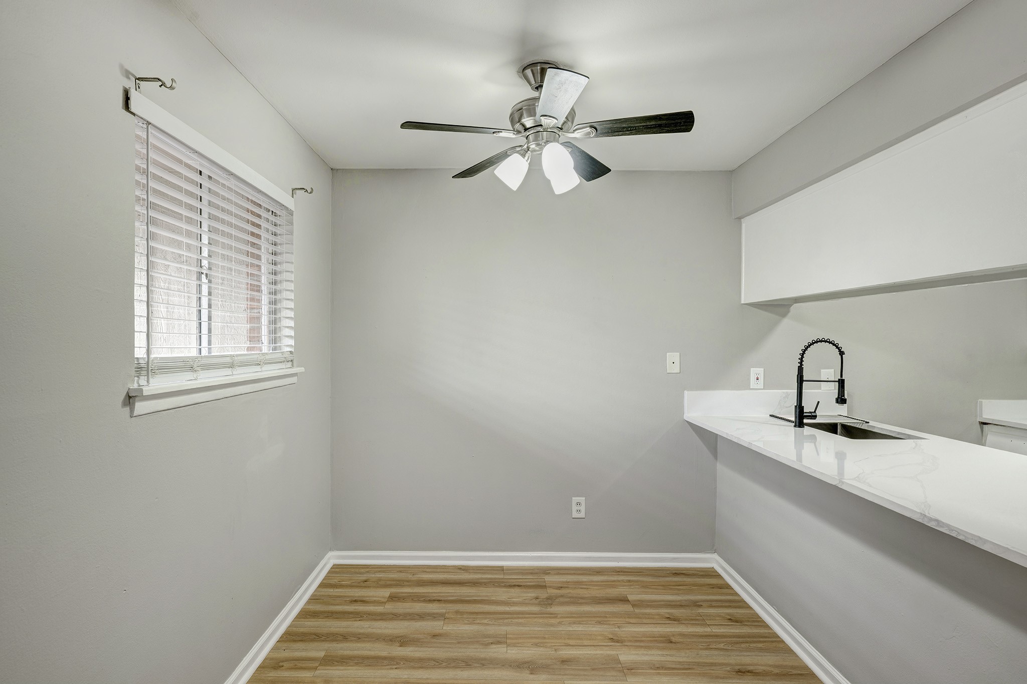 1529 Wirt Road, Unit 20 Houston, TX 77055 - Photo 7 of 12 a view of a kitchen with a sink and chandelier fan