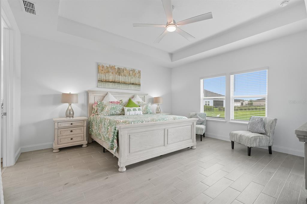 2128 Raglan Circle Ormond Beach, FL 32174 - Photo 16 of 55 a bed room with a bed and a chair