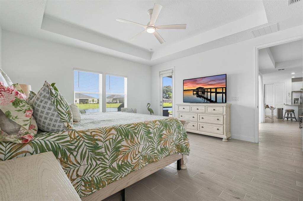 2128 Raglan Circle Ormond Beach, FL 32174 - Photo 17 of 55 a living room with furniture and a flat screen tv