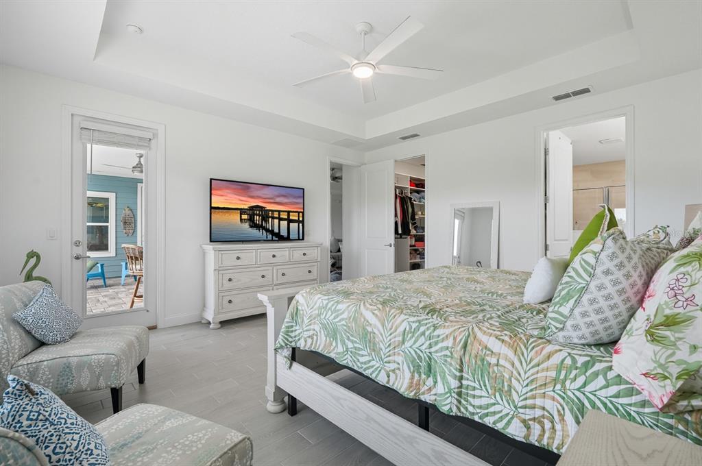 2128 Raglan Circle Ormond Beach, FL 32174 - Photo 18 of 55 a bedroom with a bed and a flat screen tv