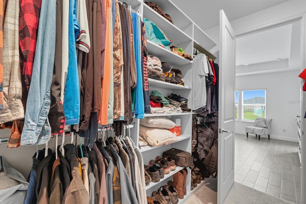 2128 Raglan Circle Ormond Beach, FL 32174 - Photo 23 of 55 a view of walk in closet with clothes and shoes