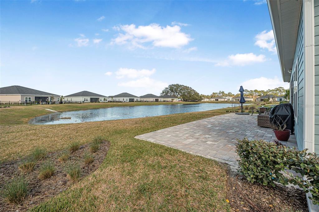 2128 Raglan Circle Ormond Beach, FL 32174 - Photo 40 of 55 a view of a lake with houses in the background