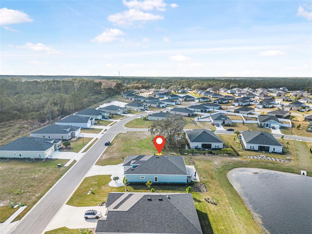 2128 Raglan Circle Ormond Beach, FL 32174 - Photo 50 of 55 an aerial view of a house with a swimming pool