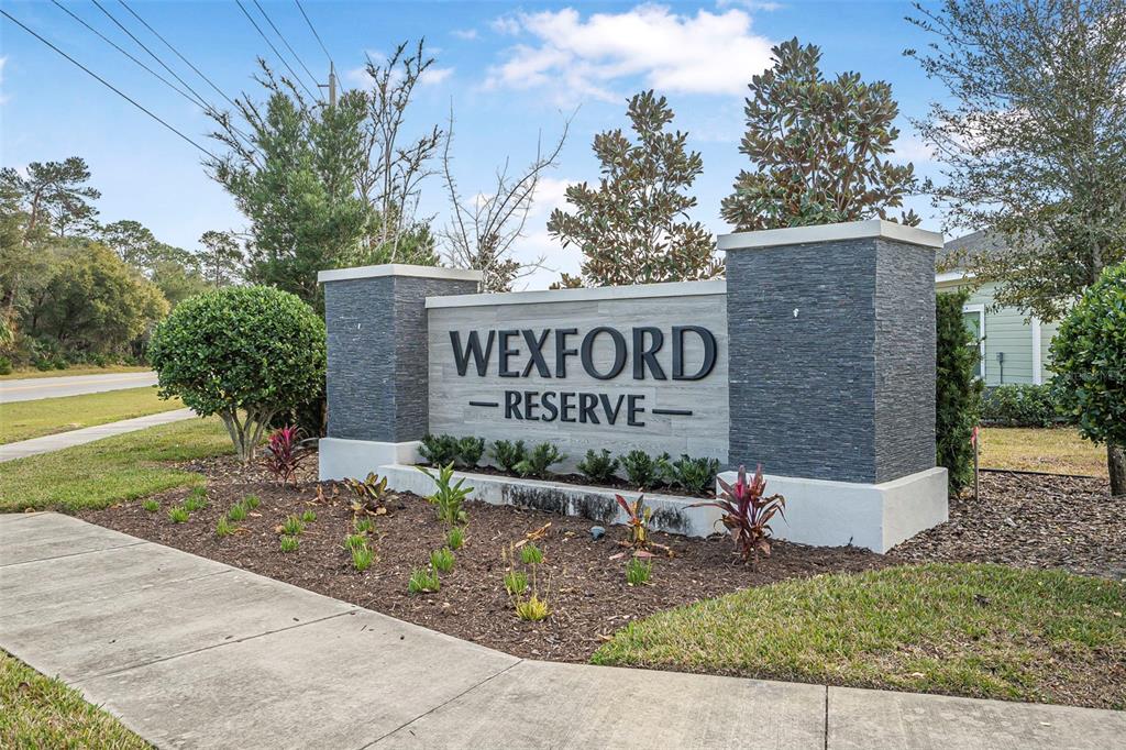 2128 Raglan Circle Ormond Beach, FL 32174 - Photo 51 of 55 a sign on the side of a building