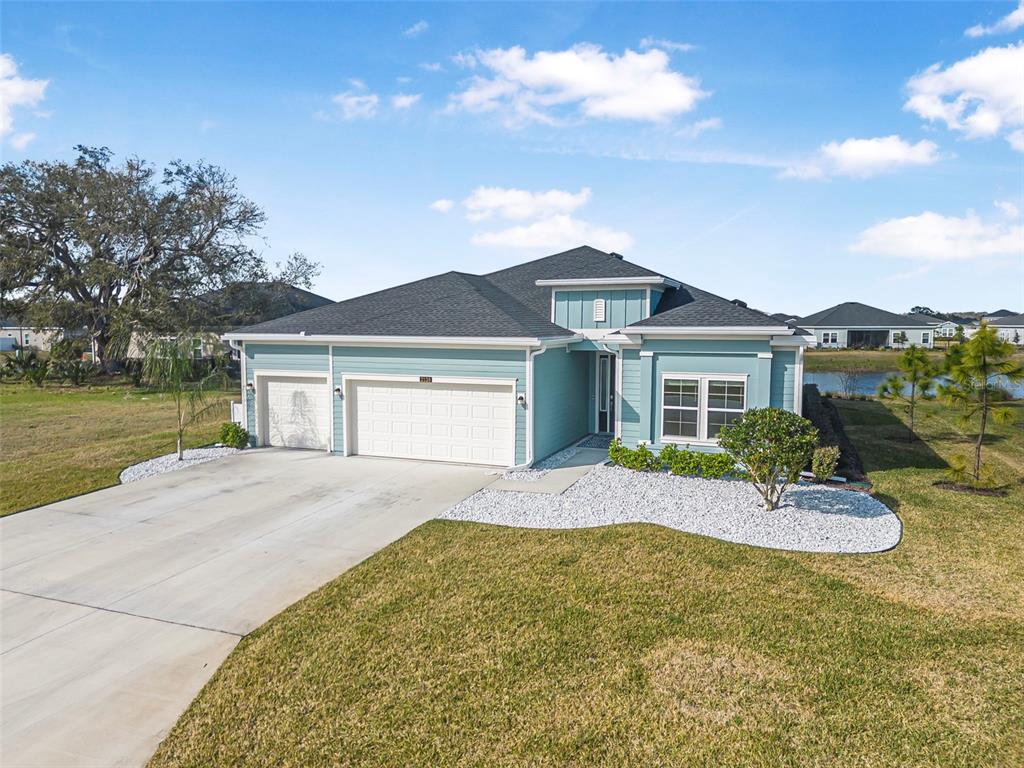 2128 Raglan Circle Ormond Beach, FL 32174 - Photo 54 of 55 a front view of a house with a yard