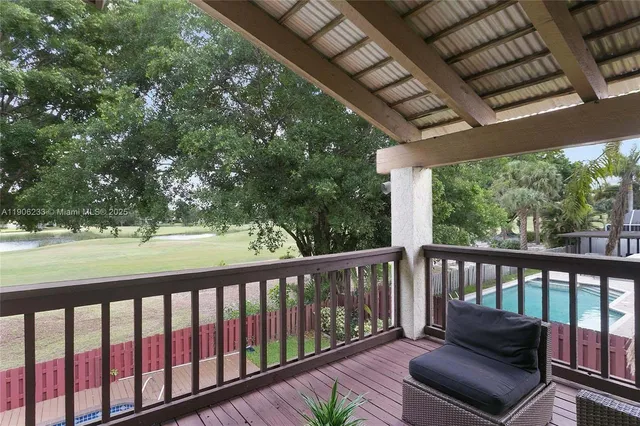 a view of a porch with furniture