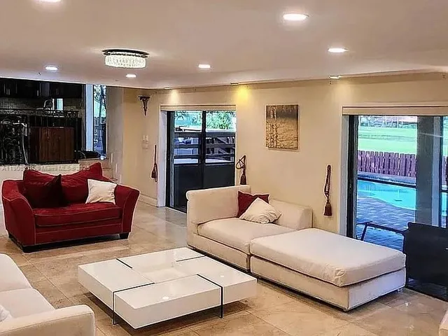 a bedroom with a bed window and couch