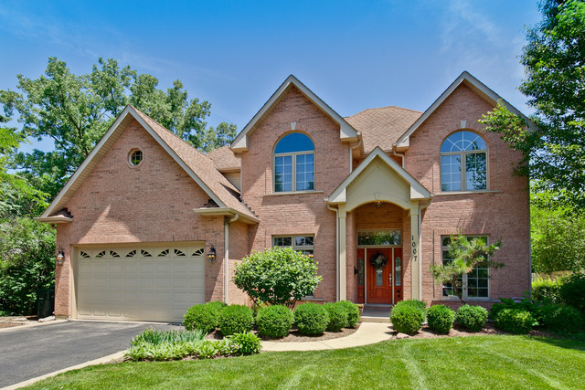 1007 Whitfield Road Northbrook, IL 60062 - Photo 1 of 27 front view of a house with a yard