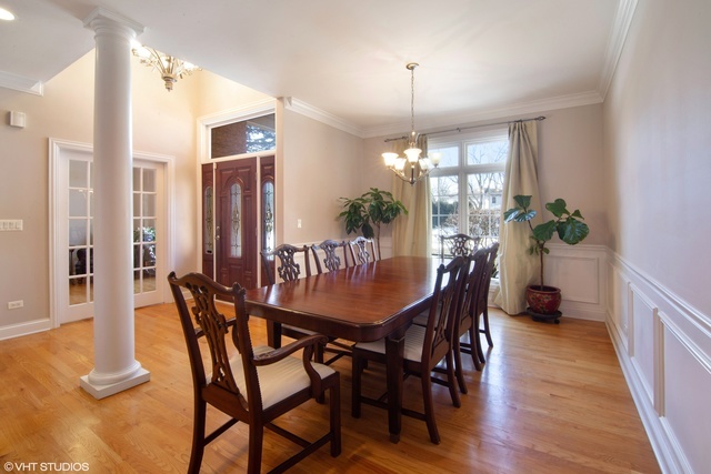 1007 Whitfield Road Northbrook, IL 60062 - Photo 7 of 27 a view of a dining room with furniture window and wooden floor