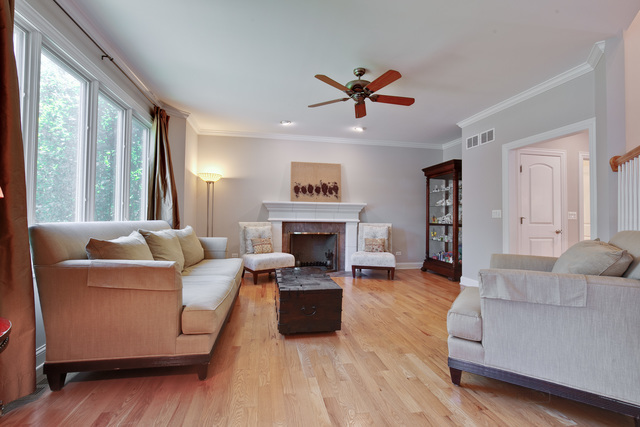 1007 Whitfield Road Northbrook, IL 60062 - Photo 9 of 27 a living room with furniture and a fireplace