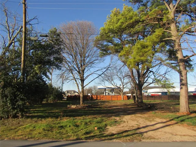 a view of a yard covered with trees