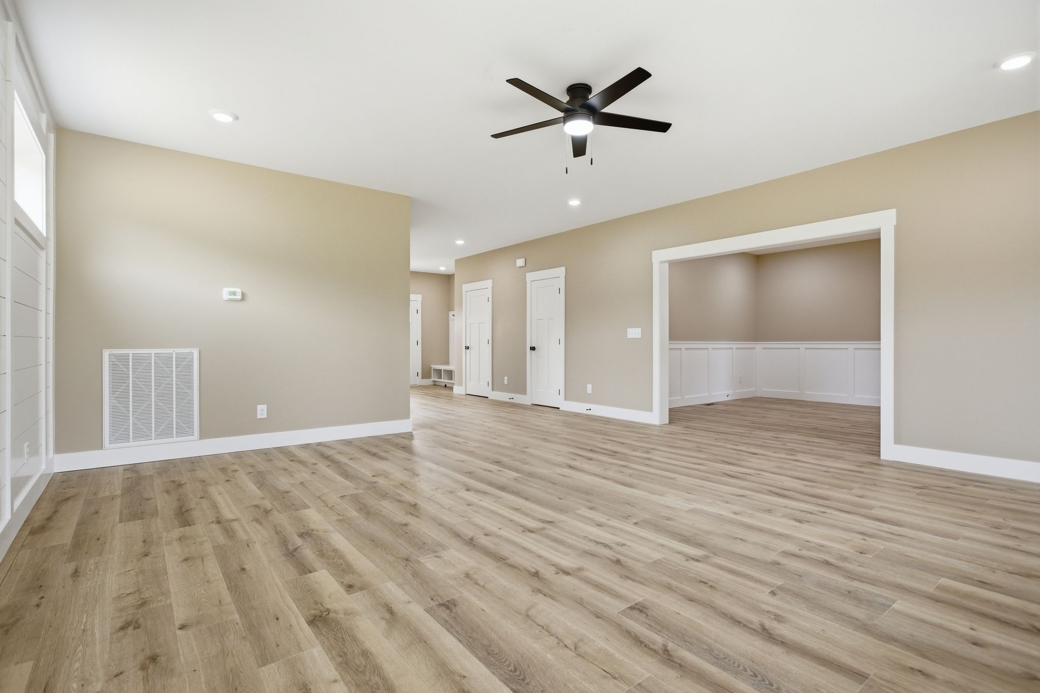 3319 Booker Ridge Road Mount Pleasant, TN 38474 - Photo 18 of 51 a view of an empty room with wooden floor and a ceiling fan
