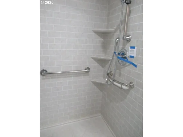 a bath room with a shower