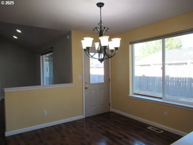 a view of a room with window and wooden floor