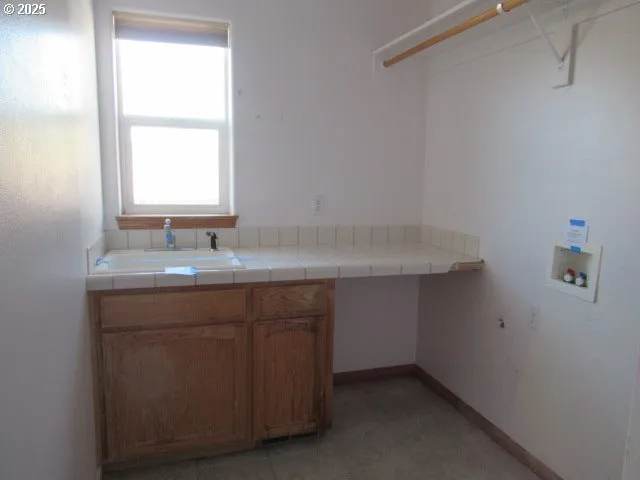 a bathroom with a sink vanity and a mirror