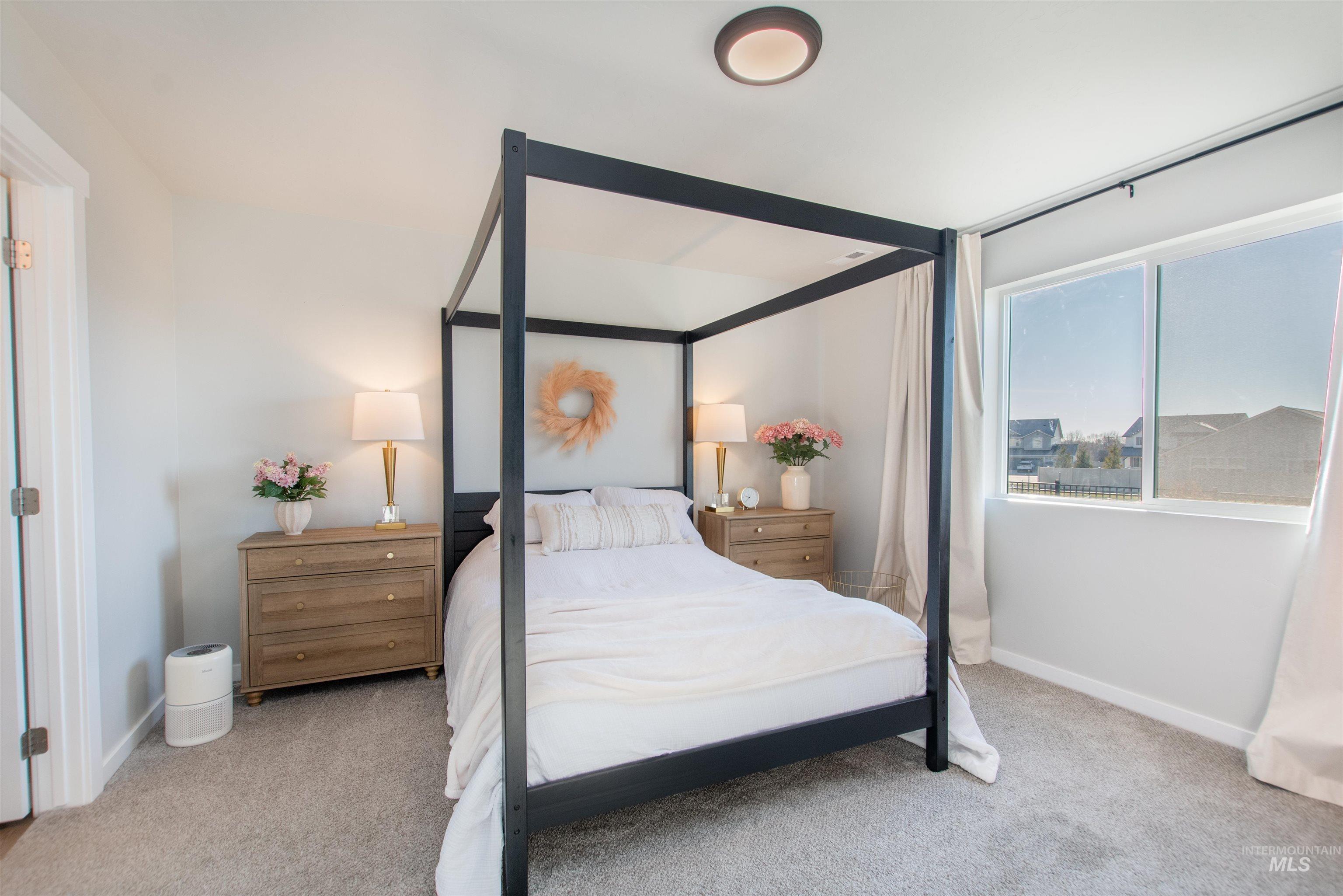 11289 West Langit Street Star, ID 83669 - Photo 13 of 33 Bedroom featuring light colored carpet