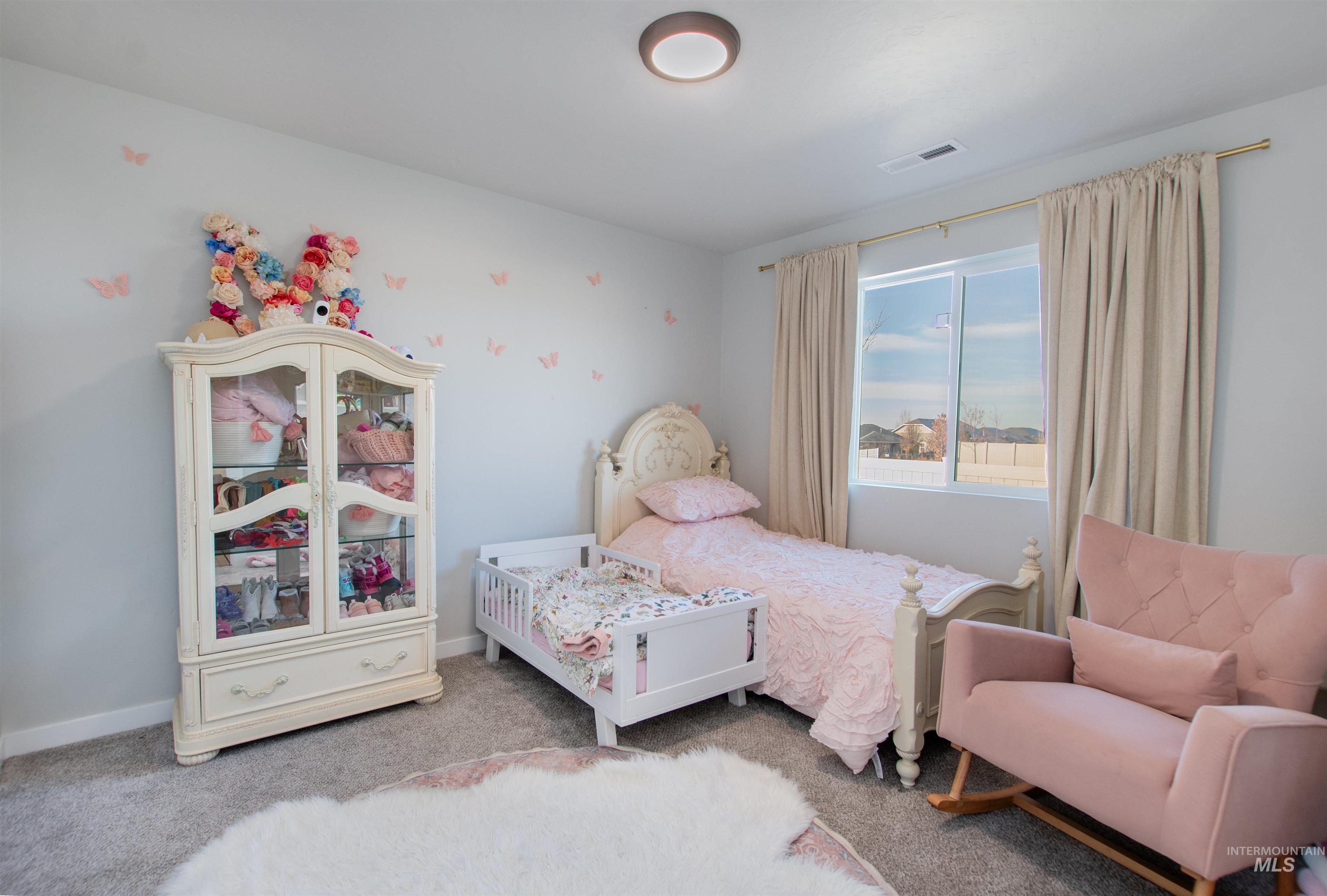 11289 West Langit Street Star, ID 83669 - Photo 16 of 33 Carpeted bedroom with baseboards