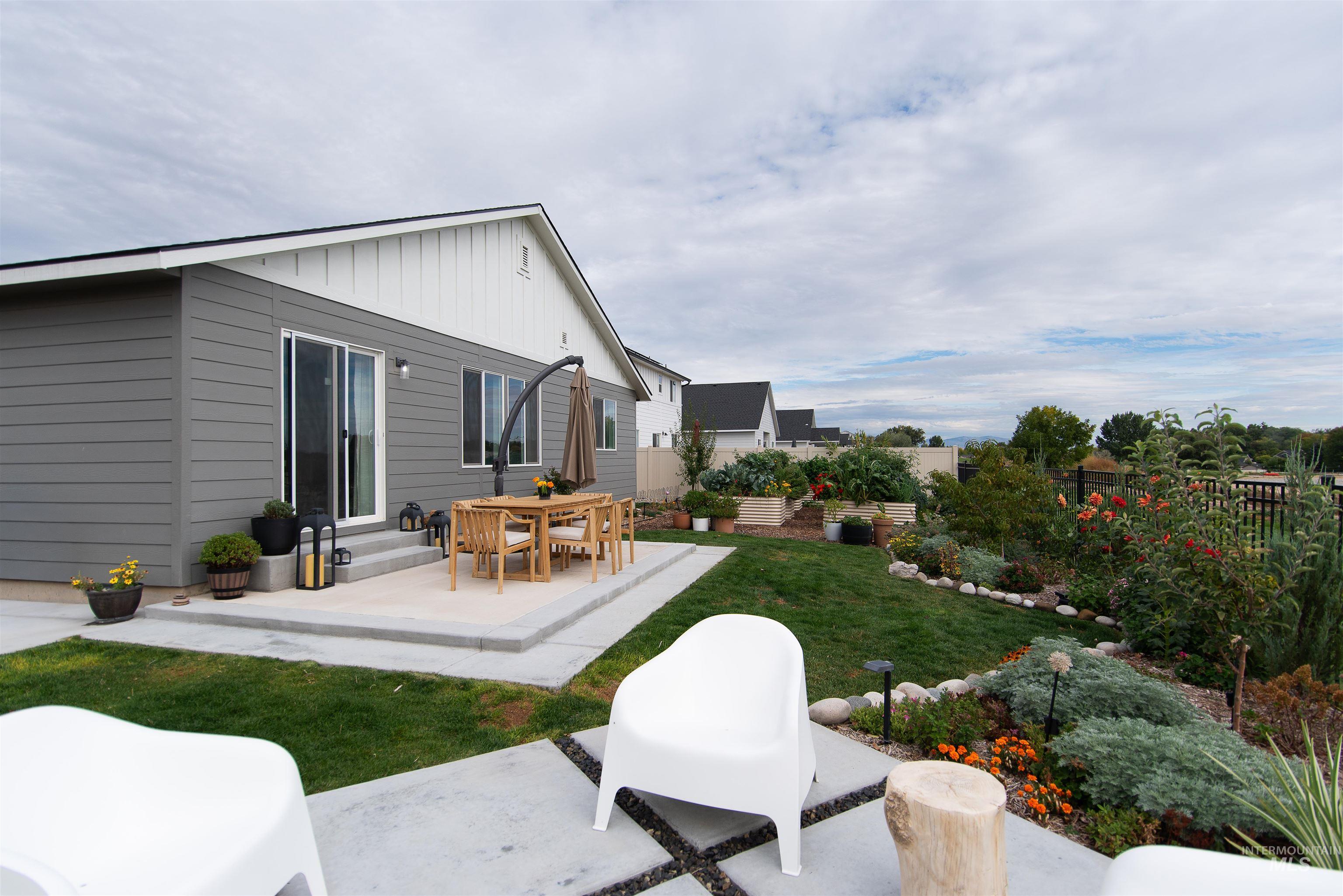 11289 West Langit Street Star, ID 83669 - Photo 25 of 33 Fenced backyard with a patio area and entry steps