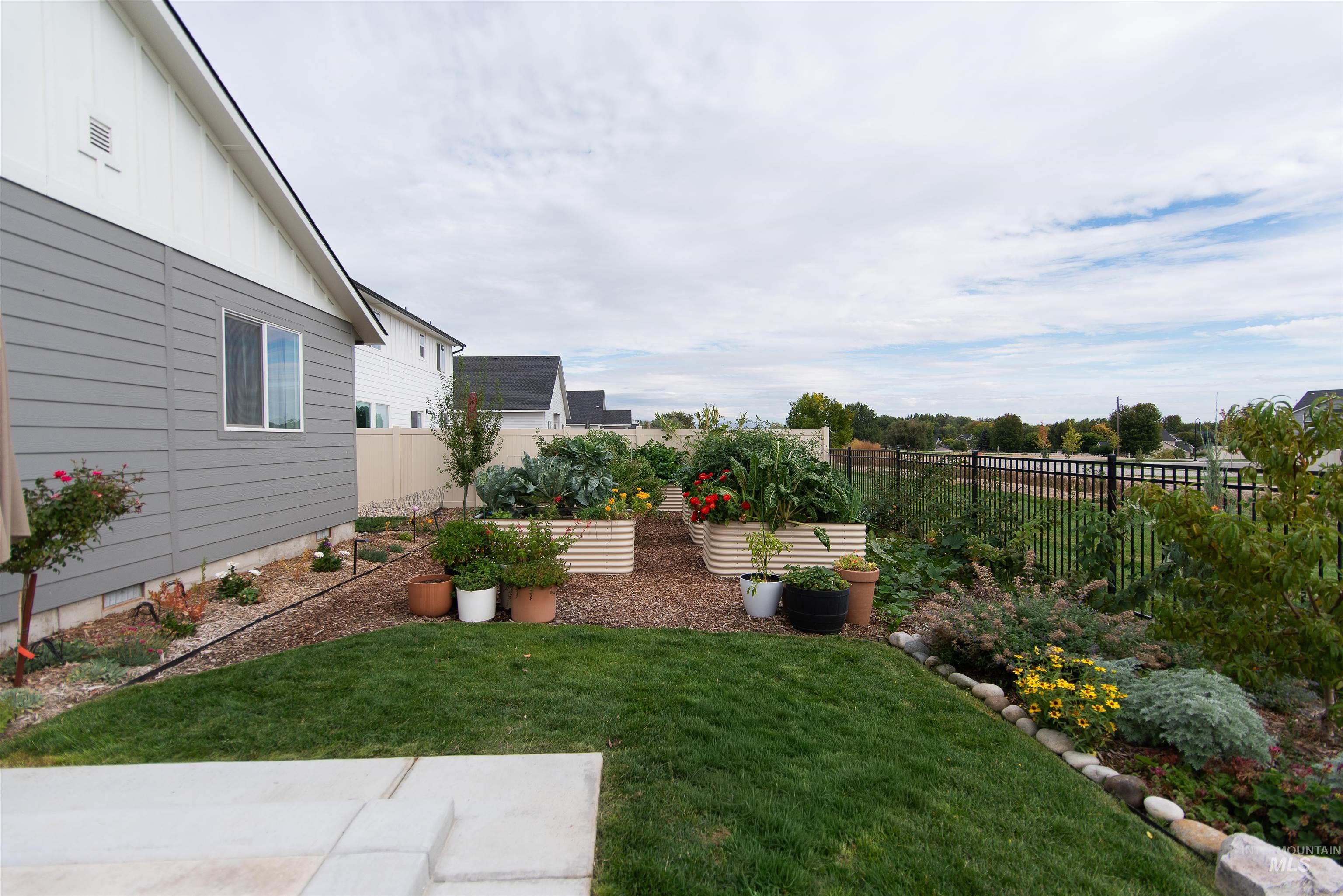 11289 West Langit Street Star, ID 83669 - Photo 28 of 33 Fenced backyard with a garden