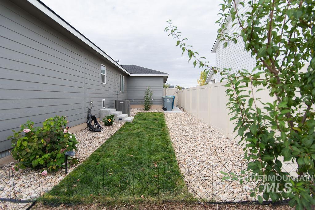 11289 West Langit Street Star, ID 83669 - Photo 29 of 33 Fenced backyard featuring a patio area