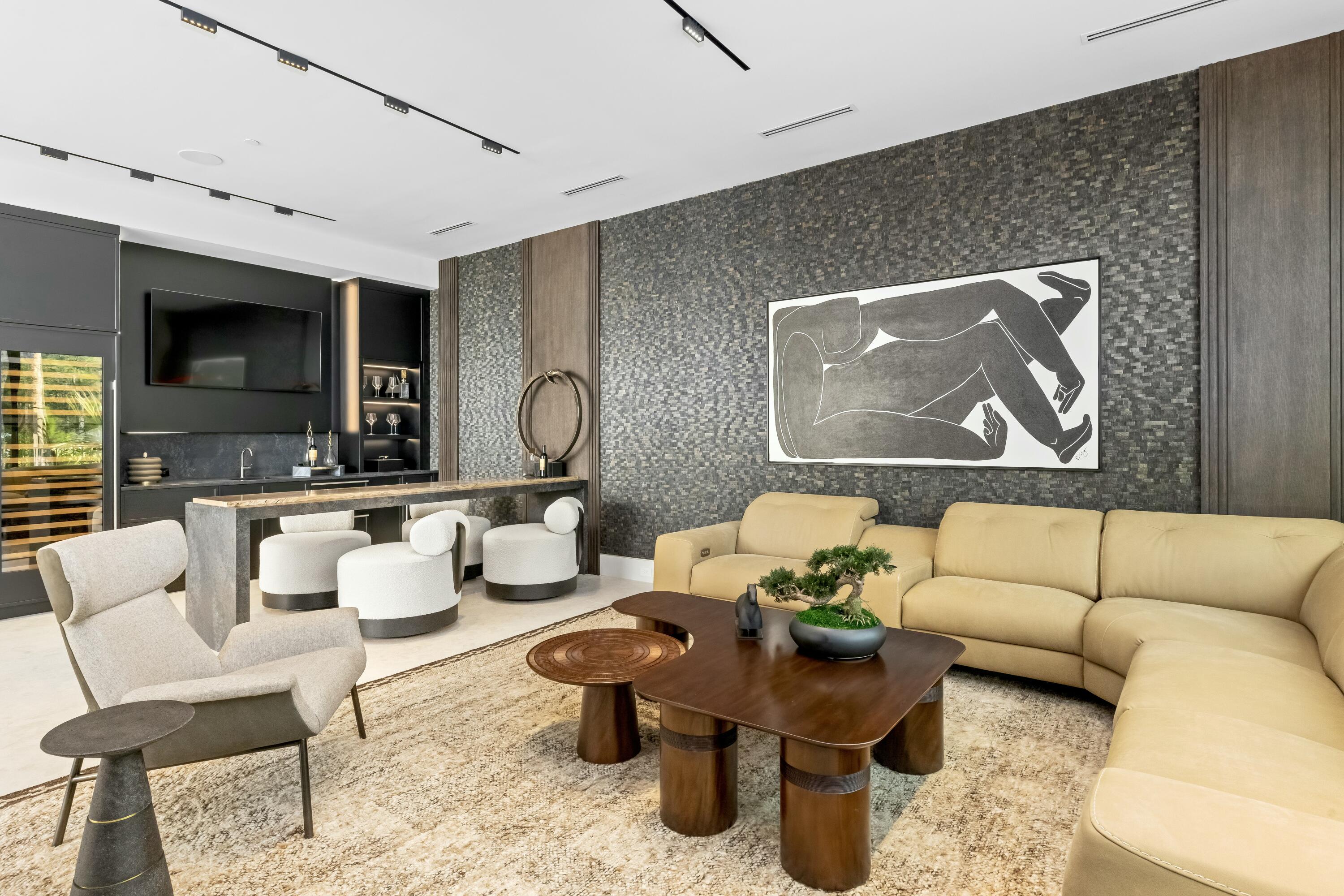 13089 Monte Rosa Court Palm Beach Gardens, FL 33412 - Photo 11 of 34 a living room with furniture a flat screen tv and a large window