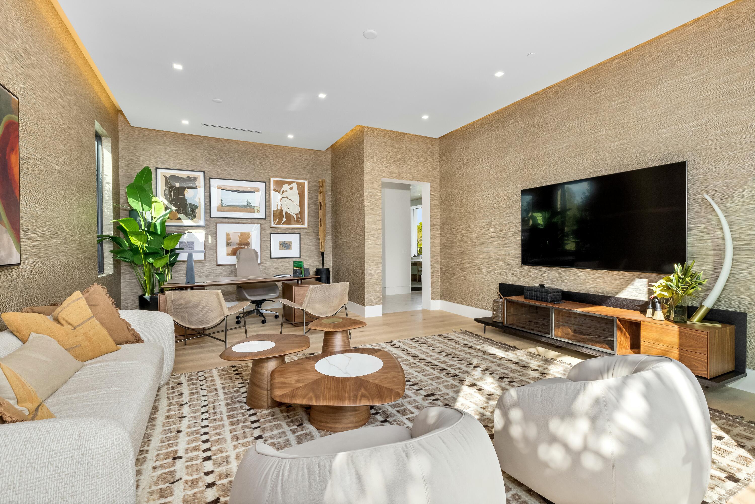 13089 Monte Rosa Court Palm Beach Gardens, FL 33412 - Photo 14 of 34 a living room with furniture and a flat screen tv