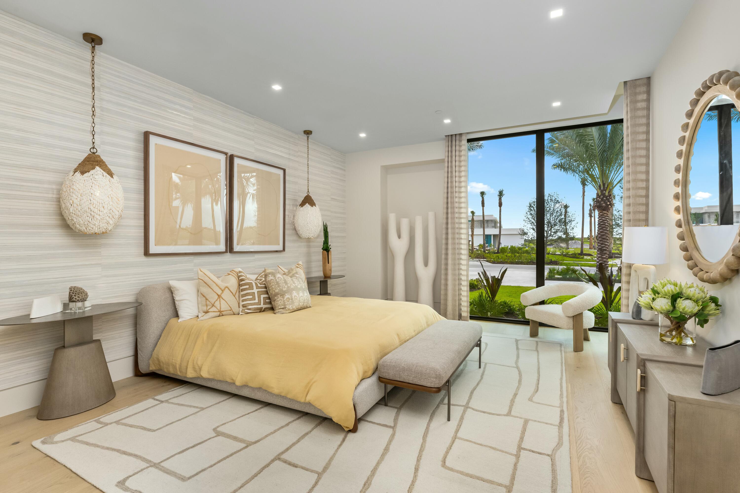 13089 Monte Rosa Court Palm Beach Gardens, FL 33412 - Photo 22 of 34 a bedroom with a bed and large windows