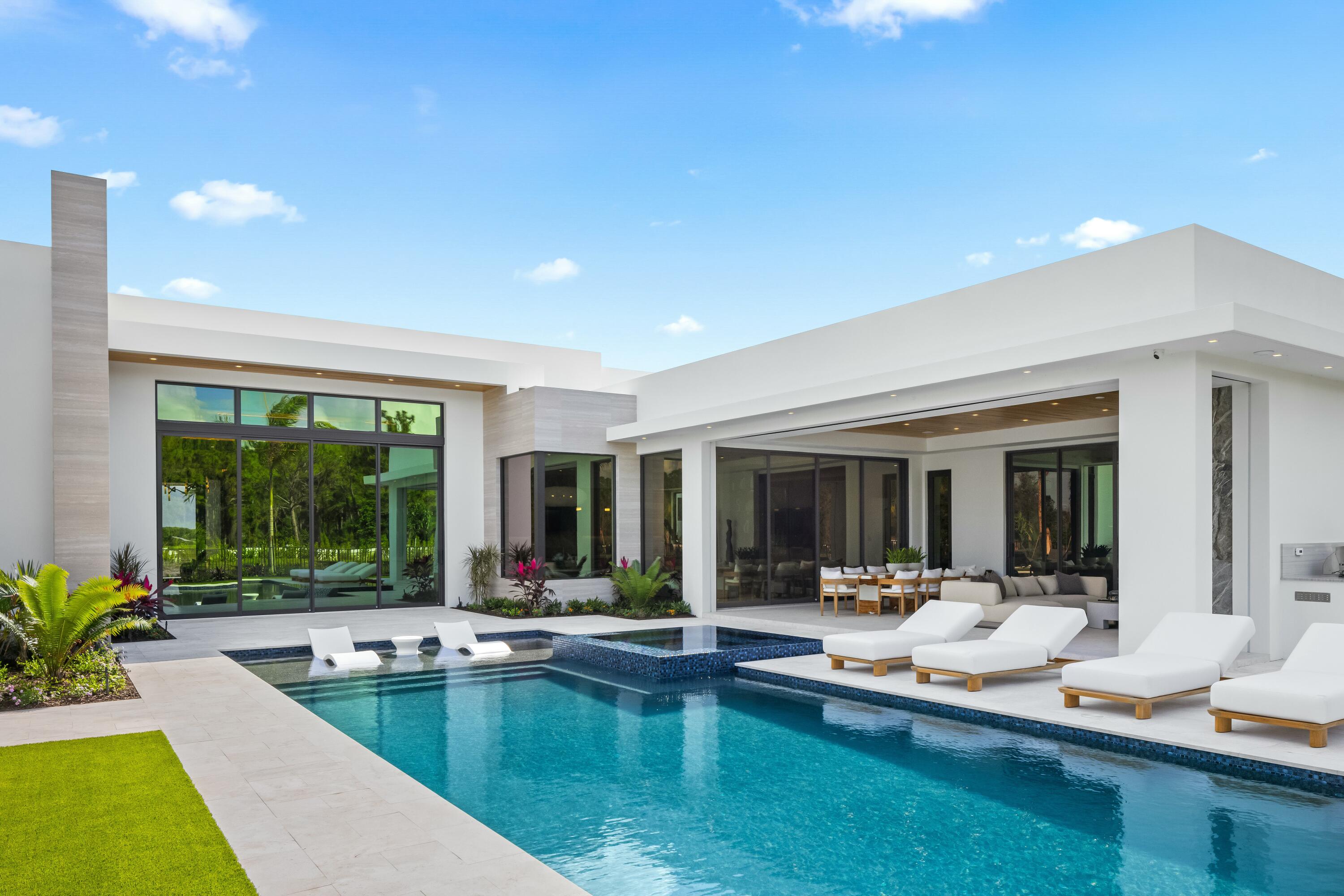 13089 Monte Rosa Court Palm Beach Gardens, FL 33412 - Photo 26 of 34 a living room with couch and a large window