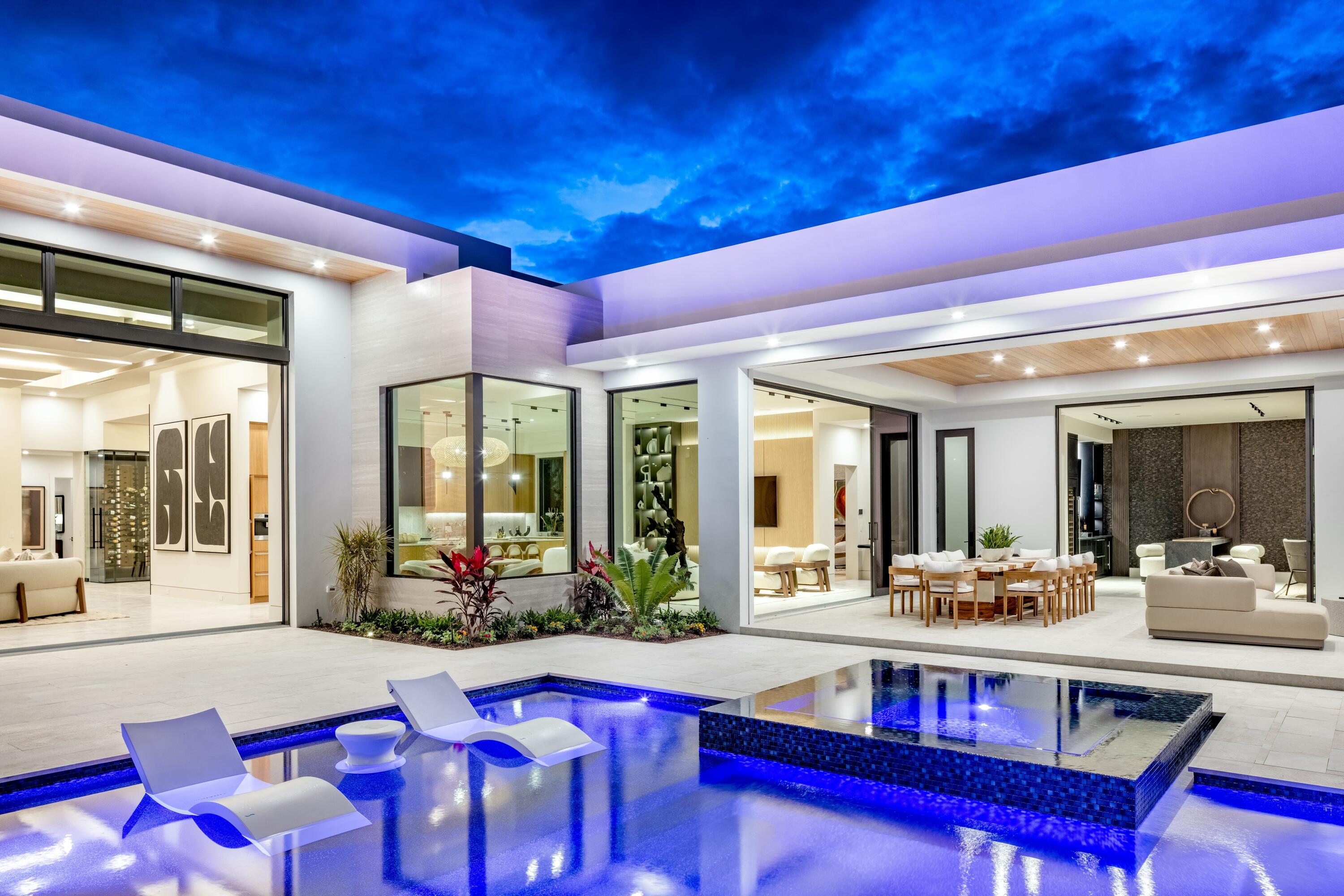 13089 Monte Rosa Court Palm Beach Gardens, FL 33412 - Photo 30 of 34 a view of a dining room with furniture window and wooden floor