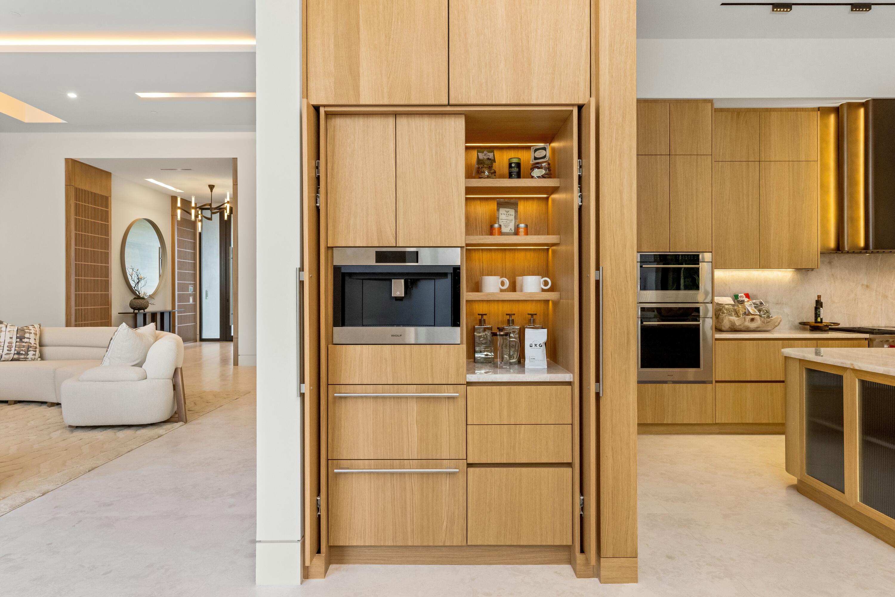 13089 Monte Rosa Court Palm Beach Gardens, FL 33412 - Photo 6 of 34 a kitchen with stainless steel appliances a refrigerator stove and microwave