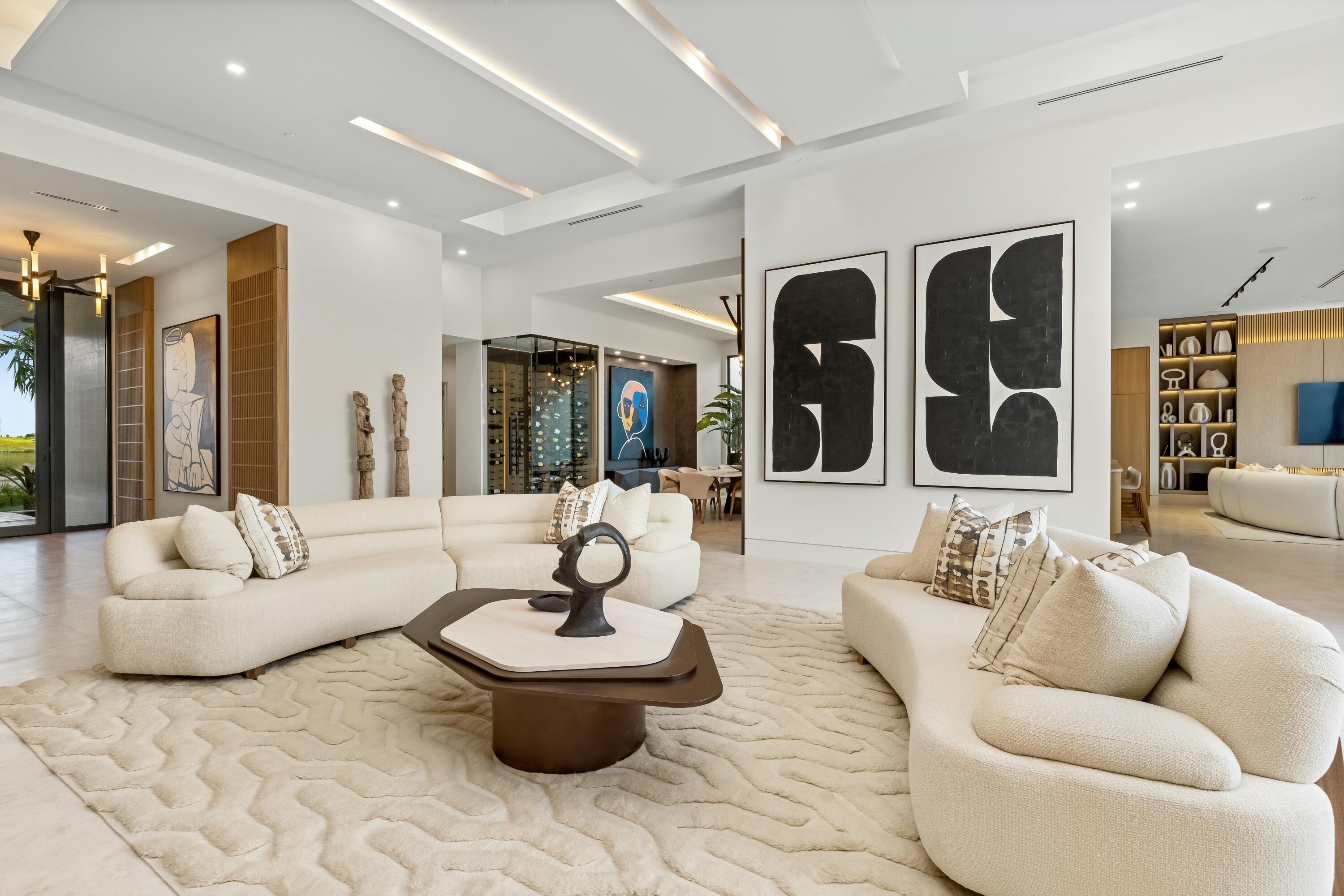 13089 Monte Rosa Court Palm Beach Gardens, FL 33412 - Photo 8 of 34 a living room with furniture and a large window