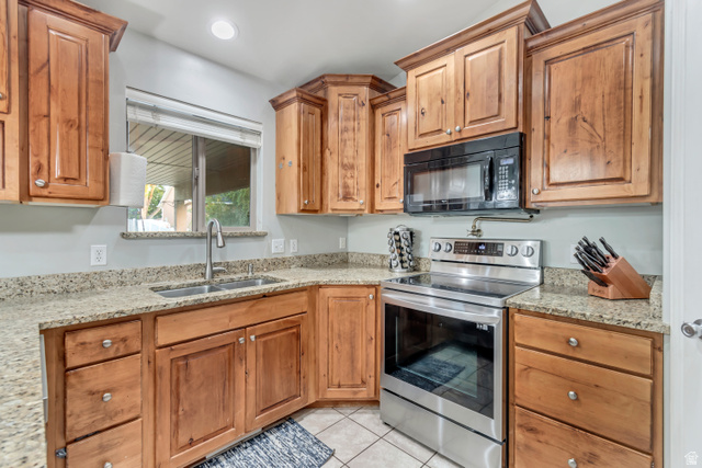 356 North 230 West Payson, UT 84651 - Photo 7 of 45 Kitchen with wood cabinetry, granite-finish countertops, and stainless steel appliances